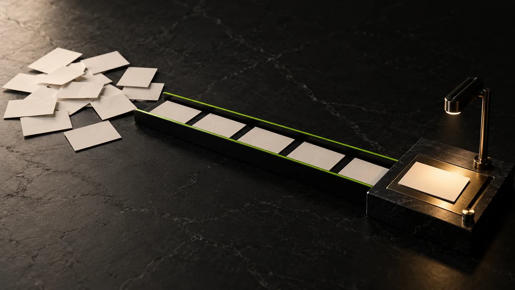 Blank ivory cards arranged in a lime-edged black channel, ending at an illuminated inspection tray on a dark stone desk